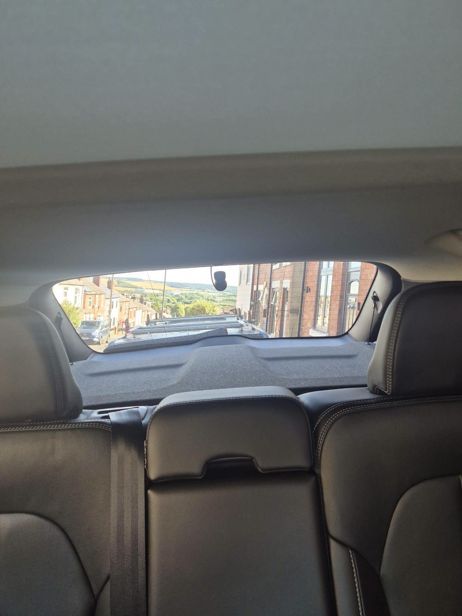 Rear dash camera fitted at the back window of a vehicle