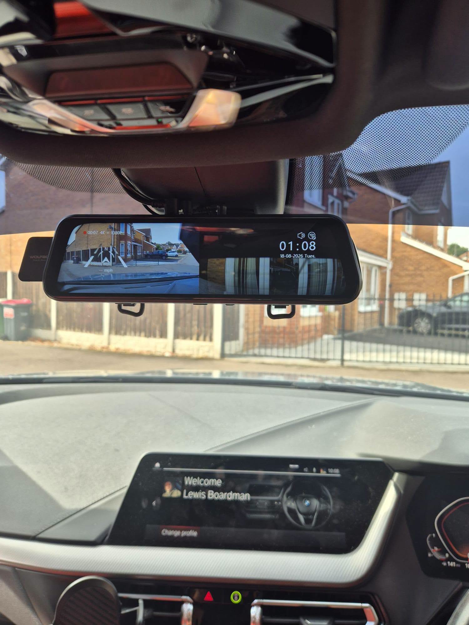 Mirror dash cam display showing front and rear camera views